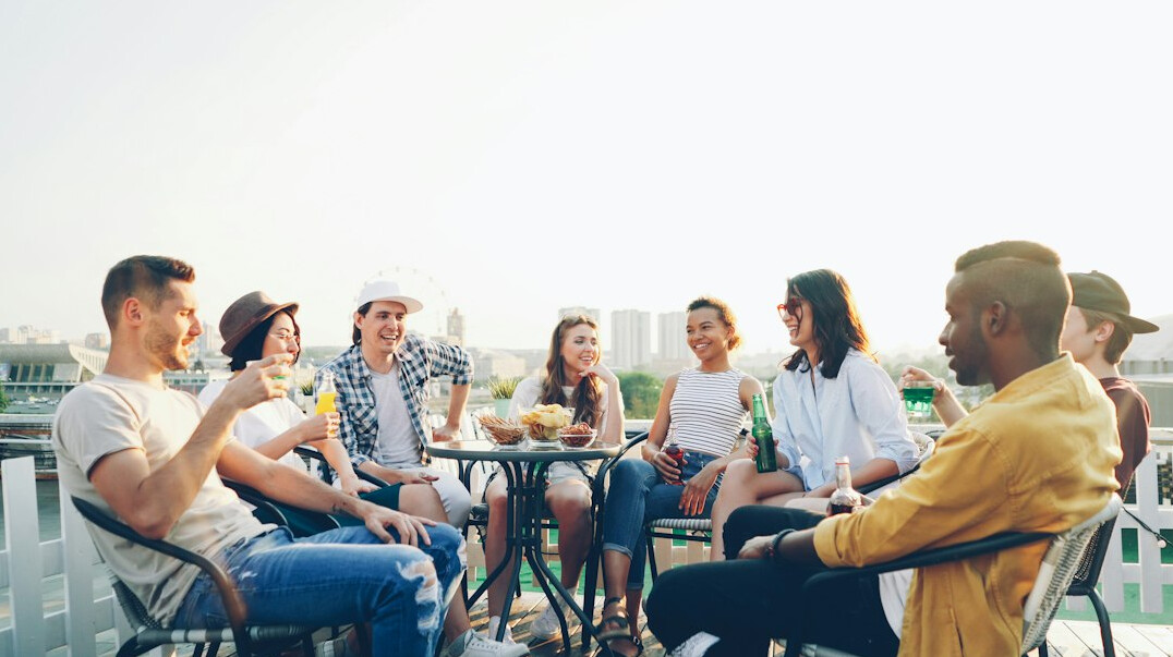 diverse group of young adults talking