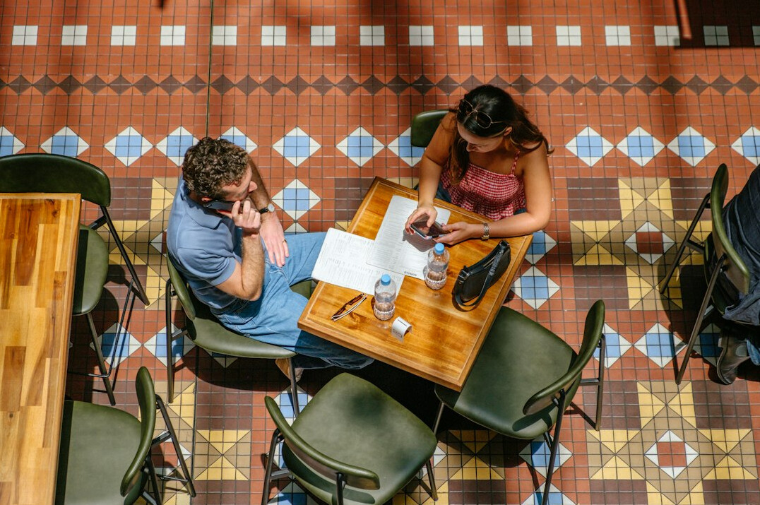people working remotely in cafe