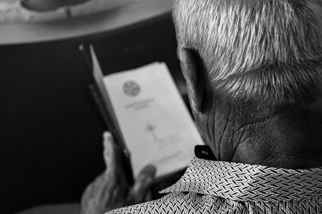 elderly person using tablet