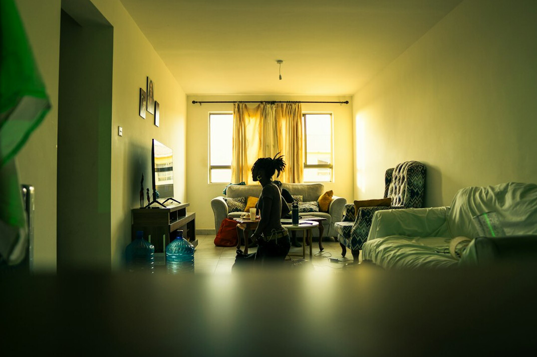 person meditating in quiet room