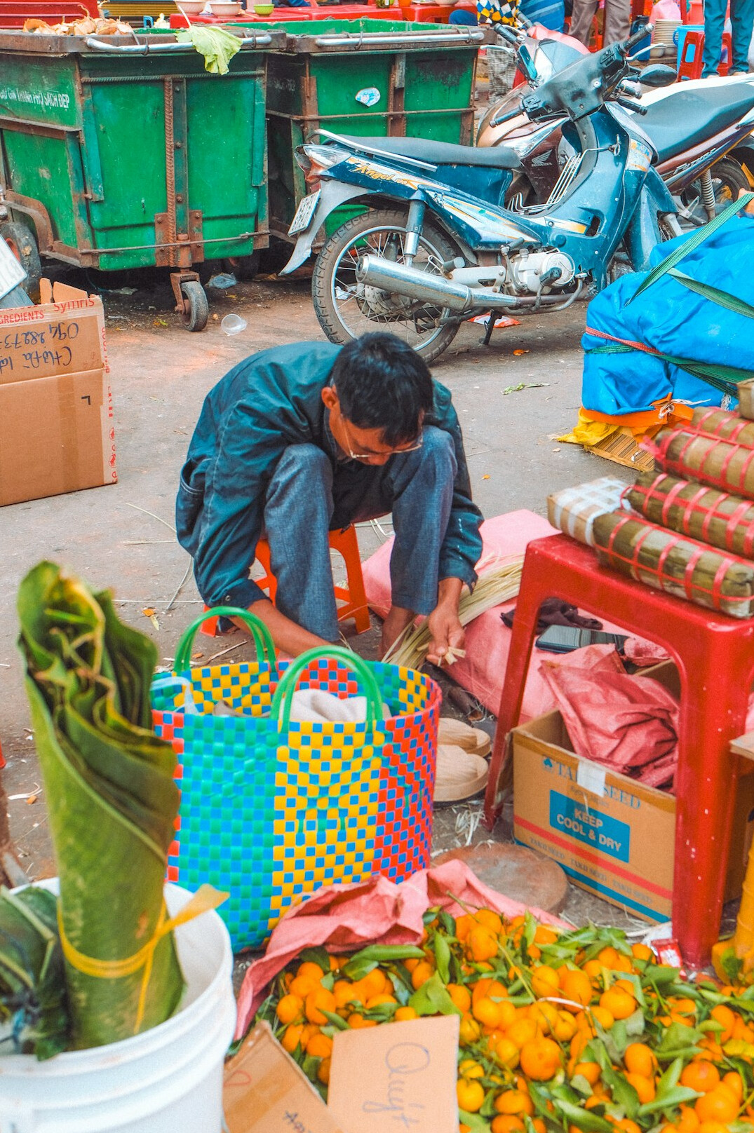 Vendor arranging fresh produce at a local street market